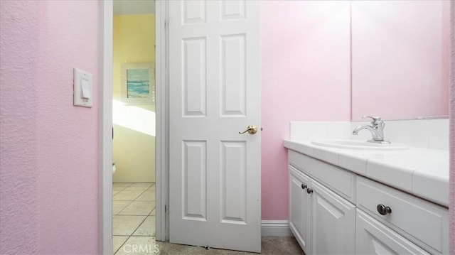 bathroom featuring tile patterned floors and vanity