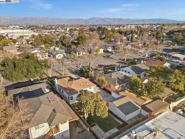 birds eye view of property featuring a mountain view