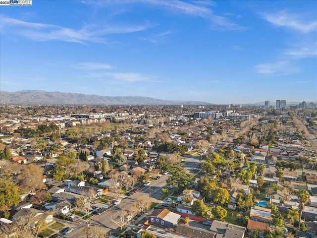 birds eye view of property with a mountain view