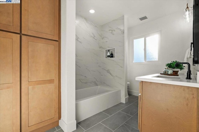 bathroom with vanity, tile patterned floors, and toilet