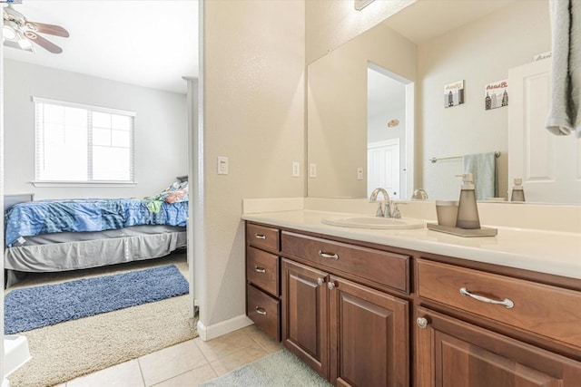 bathroom with ceiling fan, vanity, and tile patterned flooring