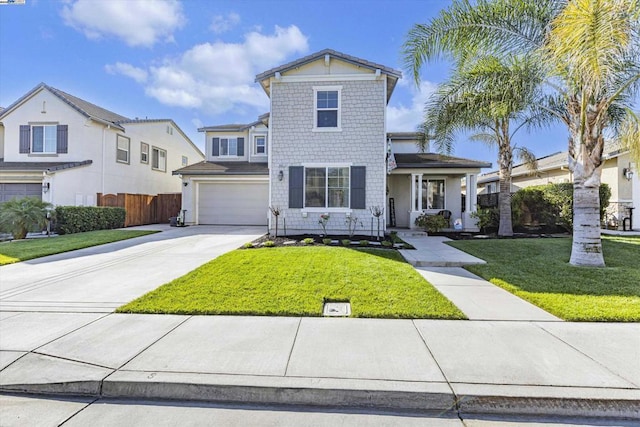 view of front property featuring a garage and a front lawn