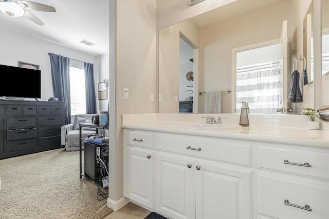 bathroom featuring ceiling fan and vanity