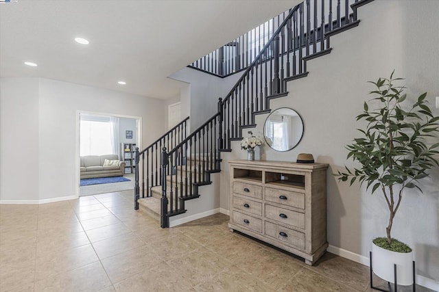 stairway featuring tile patterned floors