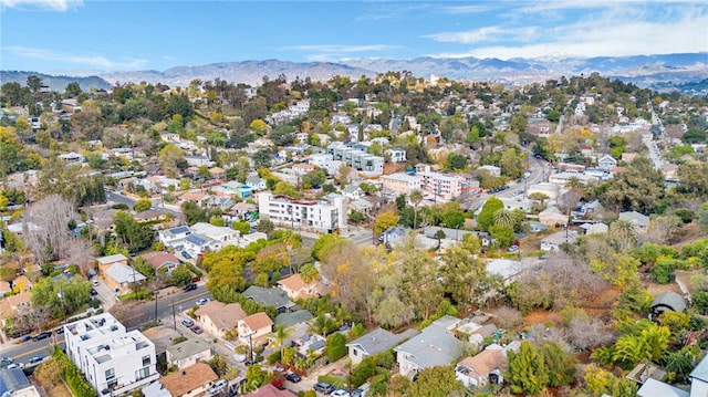 birds eye view of property with a mountain view