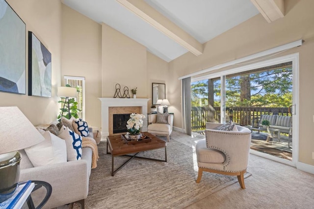 carpeted living room with beamed ceiling and high vaulted ceiling