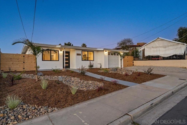 ranch-style home with a garage