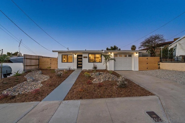 ranch-style house featuring a garage