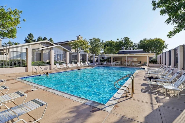 view of swimming pool featuring a patio