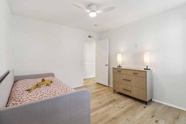 bedroom featuring light hardwood / wood-style flooring and ceiling fan