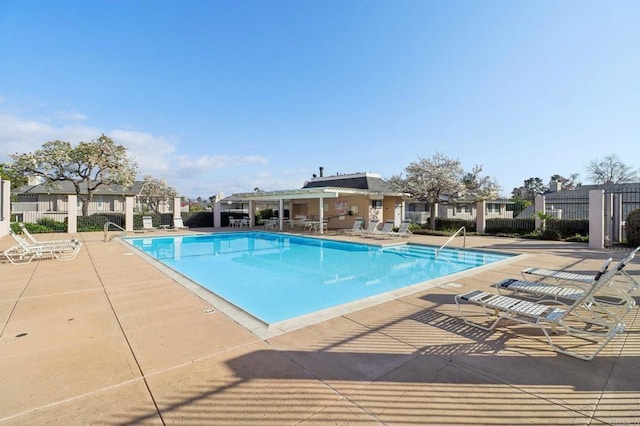 view of swimming pool with a patio