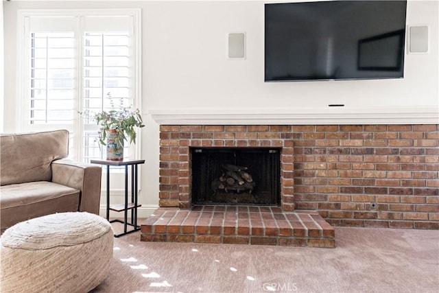 carpeted living room featuring a fireplace