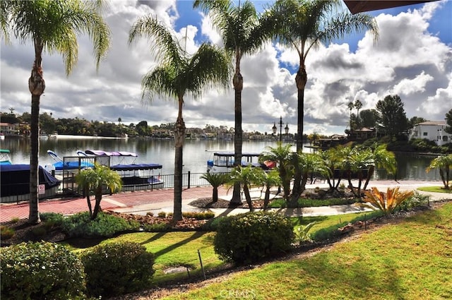 exterior space with a dock and a water view