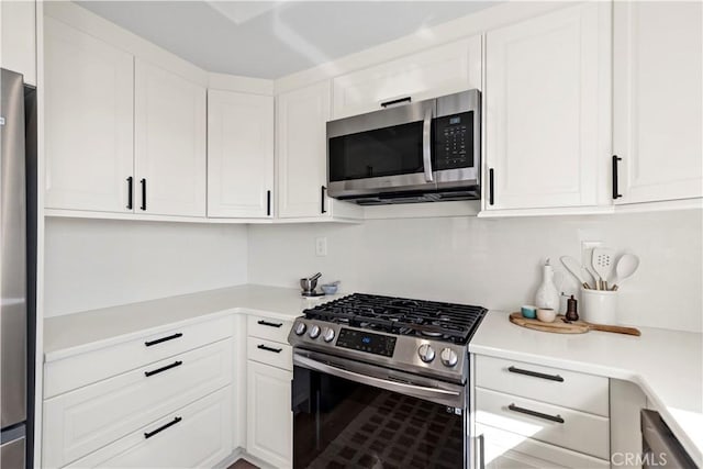 kitchen featuring white cabinetry and stainless steel appliances