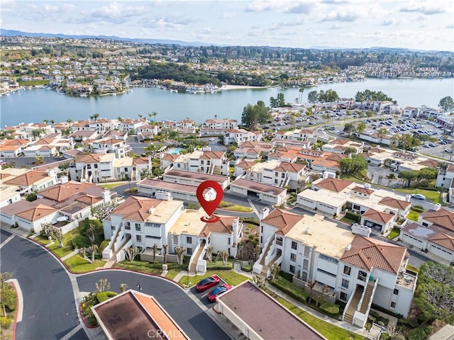 birds eye view of property with a water view