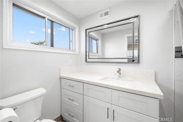 bathroom with vanity and toilet