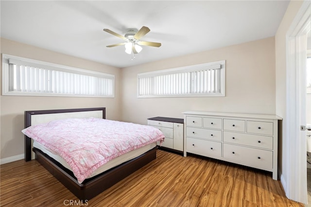 bedroom with hardwood / wood-style flooring and ceiling fan