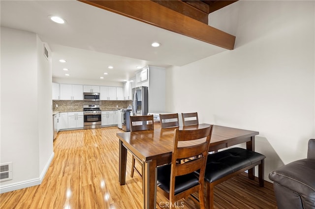 dining space featuring light hardwood / wood-style floors