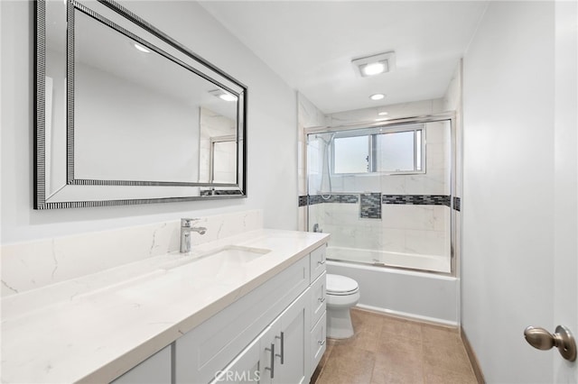 full bathroom with vanity, combined bath / shower with glass door, and toilet