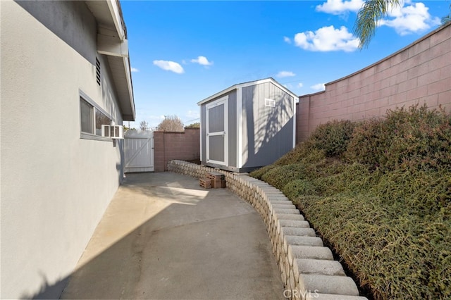 view of yard with a patio area and a storage unit