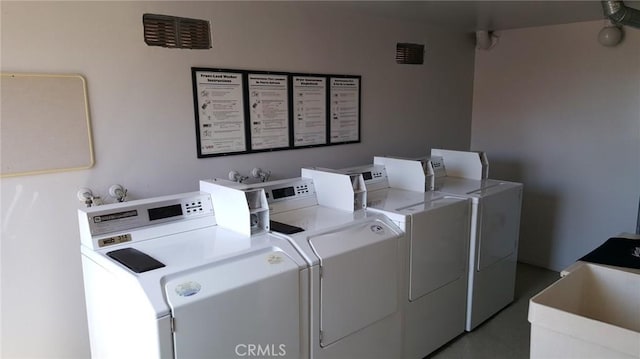 laundry room with separate washer and dryer