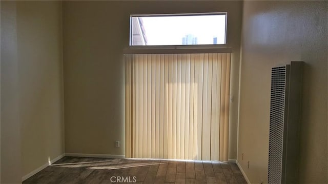 empty room with dark wood-type flooring