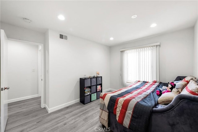 bedroom with light hardwood / wood-style flooring