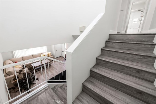 staircase featuring hardwood / wood-style floors