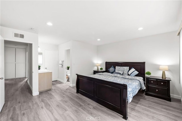 bedroom featuring light wood-type flooring