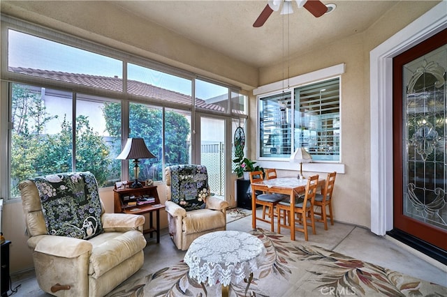 sunroom / solarium with ceiling fan