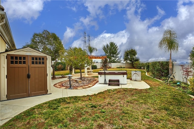 view of yard featuring a hot tub and a storage shed