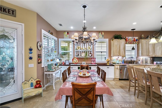 kitchen featuring an inviting chandelier, light brown cabinets, dishwasher, pendant lighting, and backsplash