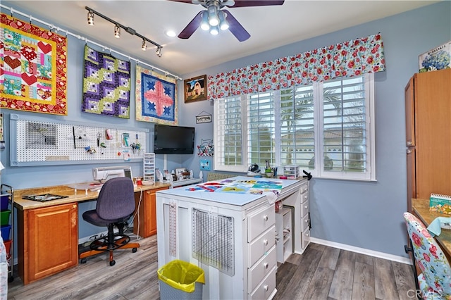 office featuring hardwood / wood-style flooring, ceiling fan, and track lighting