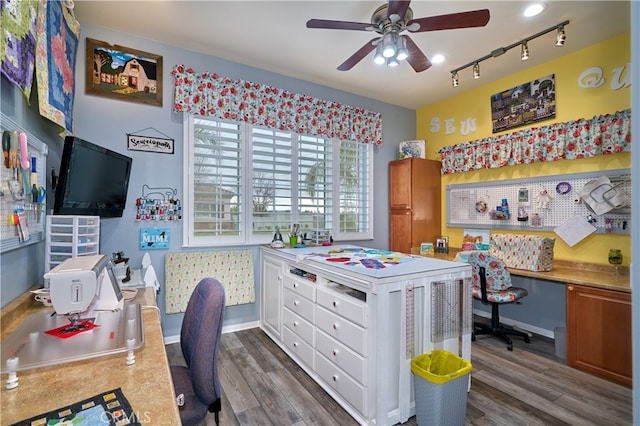 home office featuring ceiling fan, dark hardwood / wood-style floors, and rail lighting