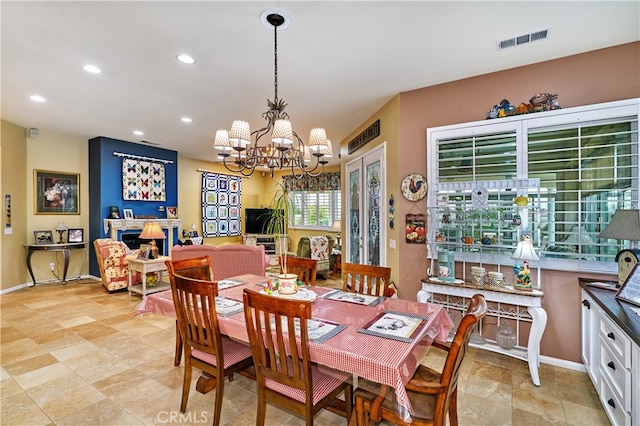 dining space with a notable chandelier