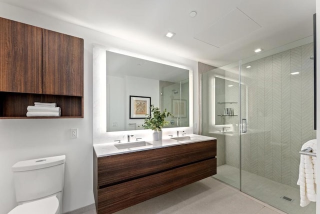 bathroom featuring tile patterned floors, vanity, toilet, and an enclosed shower