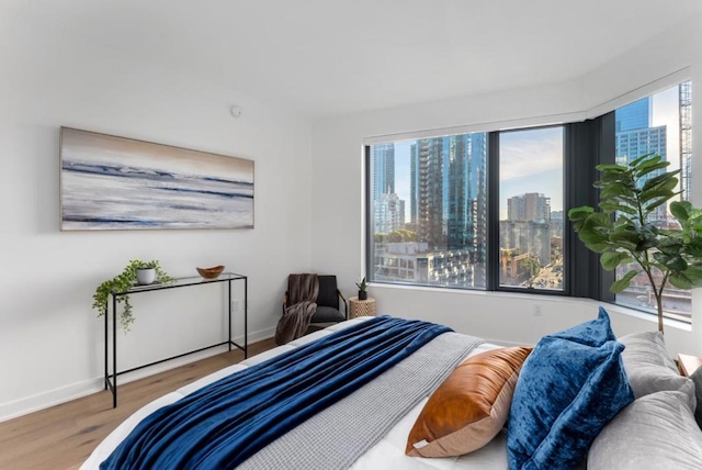 bedroom with hardwood / wood-style floors