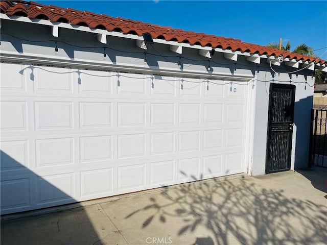 garage featuring driveway