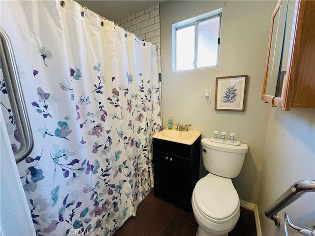 bathroom with wood finished floors, a shower with shower curtain, vanity, and toilet