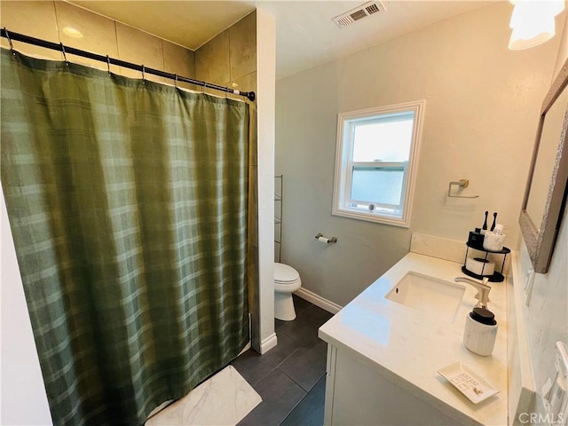 full bath with toilet, vanity, baseboards, visible vents, and tile patterned floors