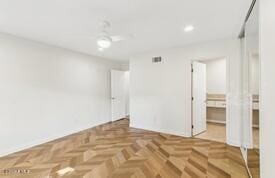 unfurnished room featuring parquet flooring