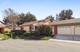 ranch-style home with a garage