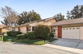 ranch-style house featuring a garage