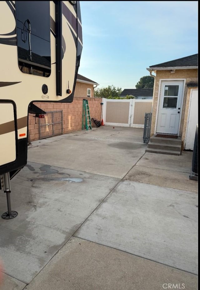 view of patio / terrace featuring entry steps and fence