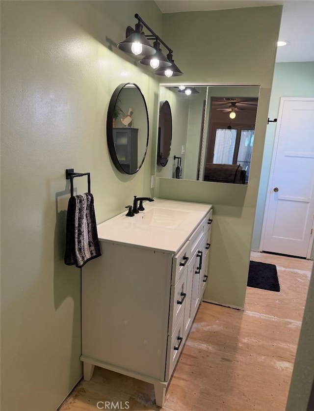 bathroom featuring wood finished floors and vanity