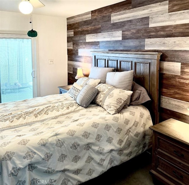 bedroom with wood walls