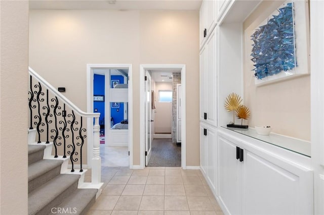 entryway with light tile patterned flooring