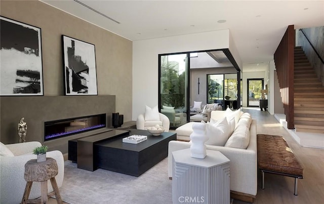 living room with light hardwood / wood-style flooring