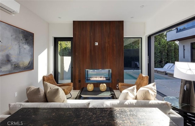 living room featuring an AC wall unit