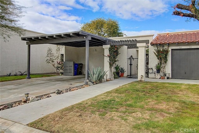 view of front of home featuring a garage and a front lawn